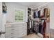 Custom walk-in closet with built-in shelving and rods for maximum storage and organization at 4979 Shadow Glen Ct, Dunwoody, GA 30338