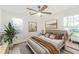 Inviting bedroom with natural light, stylish decor, and ceiling fan at 1258 Lyle Ave, Atlanta, GA 30344