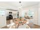 Open concept dining area with modern lighting adjacent to a fully equipped kitchen at 1258 Lyle Ave, Atlanta, GA 30344