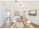 Bright dining room with modern lighting, stylish decor, and seating for four at 1258 Lyle Ave, Atlanta, GA 30344