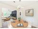Cozy dining room with round table that flows into a comfortable living area at 1258 Lyle Ave, Atlanta, GA 30344