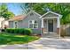 Charming renovated bungalow featuring manicured landscaping and a covered front porch at 1258 Lyle Ave, Atlanta, GA 30344