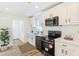 Bright kitchen featuring white cabinets, modern appliances, and vinyl plank flooring at 1258 Lyle Ave, Atlanta, GA 30344