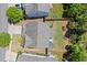 Aerial view of a home, roof and the surrounding landscaped yard, patio and trees at 357 Ridgewood Trl, Canton, GA 30115