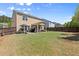 Spacious backyard with patio area, green lawn, and fence at 357 Ridgewood Trl, Canton, GA 30115