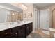 Charming bathroom with double sink vanity, tiled floor and an abundance of storage at 357 Ridgewood Trl, Canton, GA 30115