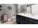 Modern bathroom featuring a double sink vanity, modern faucet, and neutral paint at 357 Ridgewood Trl, Canton, GA 30115