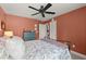Bedroom with large windows, plush carpet, and warm coral paint at 357 Ridgewood Trl, Canton, GA 30115