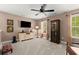 Cozy bonus room featuring neutral paint, carpeted flooring, ceiling fan, and lots of natural light at 357 Ridgewood Trl, Canton, GA 30115