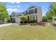 Charming home with a lush green lawn and well-manicured landscaping at 357 Ridgewood Trl, Canton, GA 30115