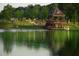 Picturesque lake view with a gazebo and recreation area on the grassy bank at 357 Ridgewood Trl, Canton, GA 30115