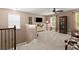 Cozy living room with a ceiling fan, natural light, and carpeted floors at 357 Ridgewood Trl, Canton, GA 30115
