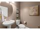 Elegant powder room with pedestal sink and neutral decor at 357 Ridgewood Trl, Canton, GA 30115