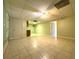 View of a large basement with tiled floors, drop ceiling and small kitchenette at 4003 Preston Place Ln, Powder Springs, GA 30127