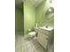 Small bathroom with a single sink vanity, toilet and mirror at 4003 Preston Place Ln, Powder Springs, GA 30127