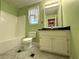 Bathroom featuring a vanity with black countertop and a shower-tub combo with updated fixtures at 4003 Preston Place Ln, Powder Springs, GA 30127