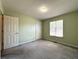 Bedroom showcasing neutral walls, plush carpeting, and ample natural light at 4003 Preston Place Ln, Powder Springs, GA 30127
