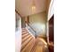Bright foyer with hardwood floors, a staircase, and natural light from the large front window at 4003 Preston Place Ln, Powder Springs, GA 30127