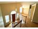 Open foyer featuring hardwood floors, high ceilings, and a view of the upper level at 4003 Preston Place Ln, Powder Springs, GA 30127