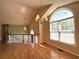 Upstairs bonus room featuring hardwood floors, bright light, and views to the main level at 4003 Preston Place Ln, Powder Springs, GA 30127