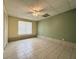 Tiled room with ample space, featuring tiled flooring and natural lighting at 4003 Preston Place Ln, Powder Springs, GA 30127