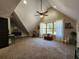 Large attic space with high ceilings, ample natural light, and versatile potential for various uses at 7350 Banks Mill Rd, Douglasville, GA 30135