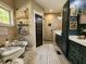 Luxurious bathroom with a claw-foot tub, tiled shower, and stylish vanity at 7350 Banks Mill Rd, Douglasville, GA 30135