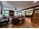 Spacious living room featuring hardwood floors, stone fireplace, and exposed wood beams at 7350 Banks Mill Rd, Douglasville, GA 30135