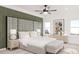 Spacious bedroom with a large headboard, a ceiling fan, and natural light at 99 Alameda St # 14, Loganville, GA 30052