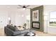 Comfortable living room featuring a fireplace and neutral tones at 99 Alameda St # 14, Loganville, GA 30052