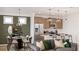 Open living room and dining area with modern decor and ample natural light at 99 Alameda St # 14, Loganville, GA 30052