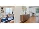View of dining room with modern decor open to kitchen, with dining table and contemporary chandelier at 275 Carriage Chase, Fayetteville, GA 30214