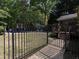 Private backyard view, highlighting the pool, lush greenery, and peaceful atmosphere at 5900 Fords Nw Rd, Acworth, GA 30101