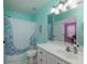 Colorful bathroom with a mermaid-themed shower curtain and an expansive vanity at 5900 Fords Nw Rd, Acworth, GA 30101