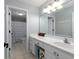 Clean bathroom featuring white cabinets, a large mirror, and a shower/tub combo at 5900 Fords Nw Rd, Acworth, GA 30101