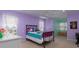 Bright bedroom with large windows and a colorful bedspread at 5900 Fords Nw Rd, Acworth, GA 30101