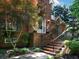 Inviting front entrance with brick stairs, black railing, and a well-maintained landscape at 5900 Fords Nw Rd, Acworth, GA 30101