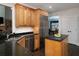 Bright kitchen features stainless steel appliances, granite counters, custom cabinets, and kitchen island at 5900 Fords Nw Rd, Acworth, GA 30101