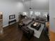Expansive living room featuring hardwood floors, high ceilings, and seamless flow to the dining and kitchen areas at 5900 Fords Nw Rd, Acworth, GA 30101
