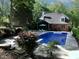 Beautiful pool with plenty of room for lounging. Adjacent screen porch adds to the fun at 5900 Fords Nw Rd, Acworth, GA 30101
