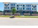 New townhomes with modern architecture, featuring brick accents and individual balconies at 118 Iveybrooke Ln # 64, Alpharetta, GA 30009
