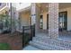 Charming brick front porch with brick detail and iron railing at 118 Iveybrooke Ln # 64, Alpharetta, GA 30009