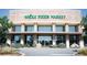 The Whole Foods Market building, surrounded by greenery, is clearly marked by a sign at the front at 118 Iveybrooke Ln # 64, Alpharetta, GA 30009