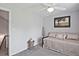 Cozy bedroom featuring neutral walls, comfortable daybed, and a ceiling fan at 1468 Briarwood Ne Rd # 703, Atlanta, GA 30319