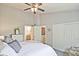 Bright bedroom showcasing a closet, large bed, and a view to an ensuite bath at 1468 Briarwood Ne Rd # 703, Atlanta, GA 30319