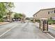 Gated community entrance with stone pillars and visitor access information at 1468 Briarwood Ne Rd # 703, Atlanta, GA 30319