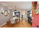 Elegant dining room showcasing a decorative wall, wooden dining set, and open access to the kitchen at 1468 Briarwood Ne Rd # 703, Atlanta, GA 30319