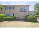 Townhouse exterior with lush landscaping and view of maintained lawn at 1468 Briarwood Ne Rd # 703, Atlanta, GA 30319