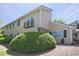 Attractive townhouse exterior with a decorative balcony and well-maintained landscaping at 1468 Briarwood Ne Rd # 703, Atlanta, GA 30319