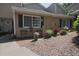 Cozy townhouse with a lovely front yard seating area, adorned with potted plants and mulched landscaping at 1468 Briarwood Ne Rd # 703, Atlanta, GA 30319
